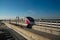 The Pink Line electric train runs on train tracks