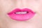 Pink lips of a young woman with a little open mouth