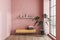 Pink living room with bench and shelf