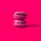 Pink macaron on color background