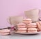 Pink macaron cookies with vintage cups