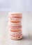 Pink macarons in a bright neutral setting