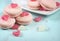 Pink macarons with pink and white jelly candy hearts