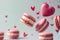 Pink macaroons flying on a pastel background with red love hearts. Valentines sweet gift