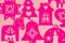 Pink magenta Christmas decorations on a coral background