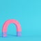 Pink magnet on bright blue background in pastel colors