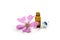 Pink mallow flower Malva and a bottle with essence, aromatic herb and medicinal plant against cough, sore throat, cold and flu,