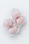 Pink marshmallows, handmade sweets, zephyr, soft confectionery, candy on a light background. Sweet marshmallow.