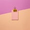 Pink memo paper, sticky notes with yellow binder clip on pink background