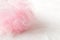 pink mesh shower sponge aka Bath puff, Bath Body Scrubber on white background. place for text.copy space