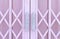 Pink metal grille sliding door with handle