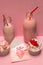 Pink milkshake bottles and cupcakes