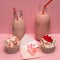 Pink milkshake bottles and cupcakes