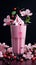 a pink milkshake with whipped cream and flowers