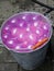 Pink mini water balloons in tin bucket