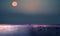 pink moon blue night starry sky and pink sunset at   sea  horizon  light  on skyline summer nature background