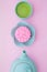 Pink mooncake, blue teapot, cup of green tea on a pink background. Chinese mid-autumn festival food
