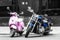 Pink moped and blue motorbike