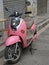 Pink motorbike on the street in Kunming, China