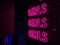 Pink neon sign on the bar
