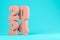 Pink numbers 2024 on a blue background 3D illustration