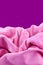 Pink nylon fabric with purple background