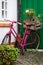 Pink old bike courtyard gate with wine box and lucky glover