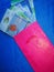 Pink packet or known as duit raya isolated on blue background