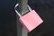 Pink padlock attached to a rail