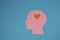 pink paper head instead of brain has a little orange heart, infatuation, flat design, human emotions,copy space