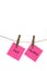 Pink Paper Notes with the Words Joy and Happy Suspended on a Clothes Line