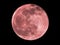 Pink Paschal full Moon in the night sky
