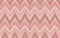 Pink pastel color tone control of zigzag chevron ikat fabric texture while is a vertical and horizontal seamless pattern