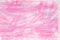 Pink pastel crayon on paper background