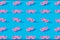 Pink pastel mustache pattern and on a blue background.