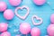 Pink pastel party balloons and pink heart on blue wooden background with copy space for text