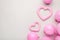 Pink pastel party balloons and pink heart on grey background with copy space for text