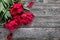 Pink peonies flowers on rustic wooden background. Selective focus