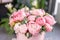 Pink peonies on the old grey table. Beautiful peony flower for catalog or online store. Floral shop concept . Beautiful