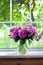 Pink peonies on window sill