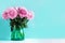 Pink peony flower on blue background. Copy space. Floral composition. Wedding, birthday, anniversary bouquet. Woman day, Mother`s