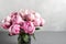 Pink peony flower on a gray background.copy space
