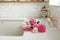 Pink peony and roses flowers in modern kitchen interior, summer floral arrangement in farmhouse. Beautiful peonies in sink on