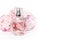 Pink perfume bottle with flowers on light background. Perfumery, cosmetics, fragrance collection