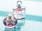 Pink perfume bottle on glossy background, sweet floral scent, glamour fragrance and eau de parfum as holiday gift and luxury