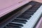 Pink piano close up. Piano keyboard