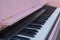 Pink piano. Piano keyboard closeup