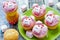 Pink pig cupcakes - homemade cupcakes decorated with cream cheese frosting and marshmallow shaped funny piggies