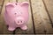 Pink piggy bank on background