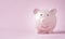 Pink piggy bank for deposit saving banking of investment , retirement to get profit and interest concept